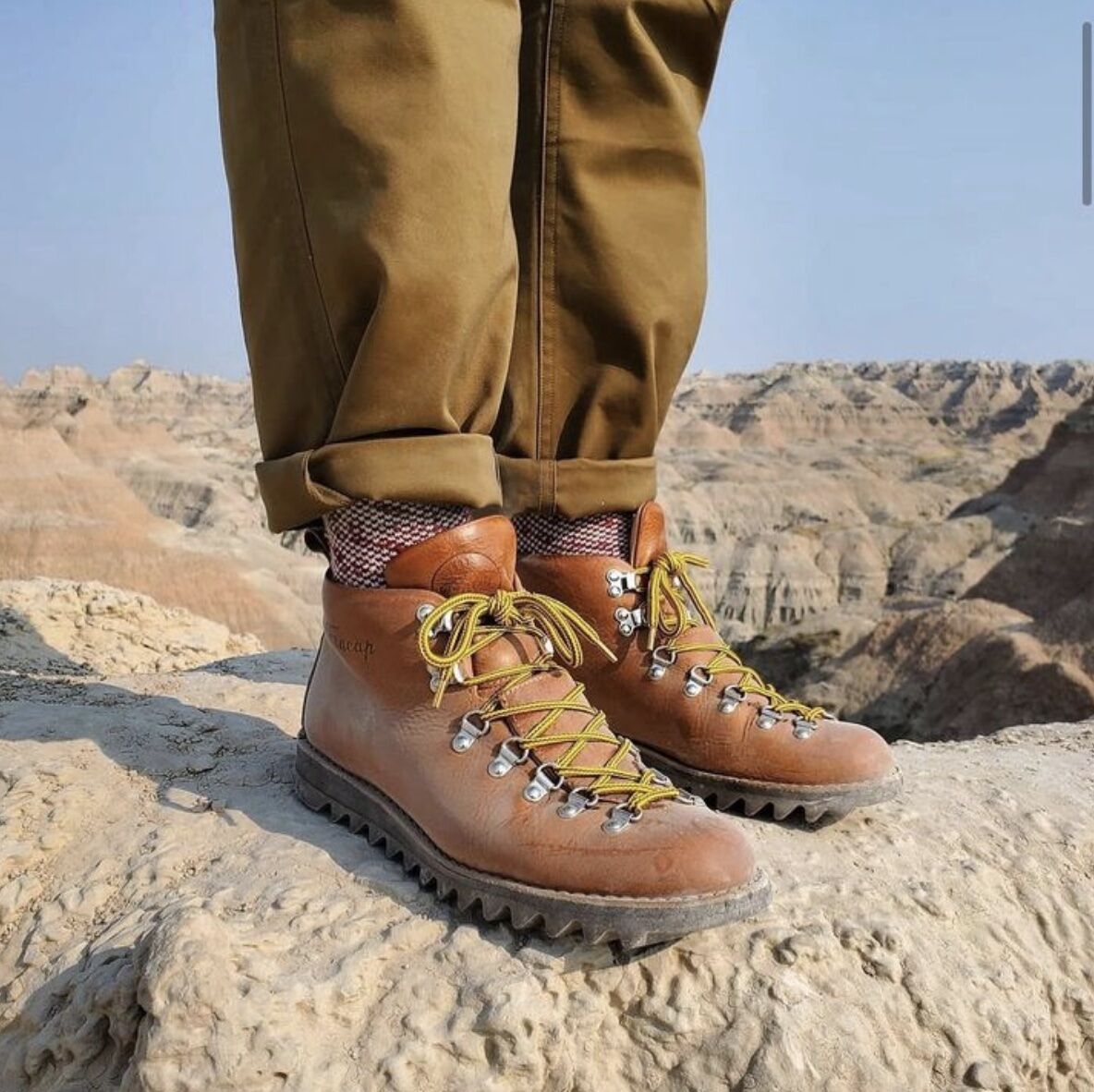 close up of leather hiking boots on a mountain