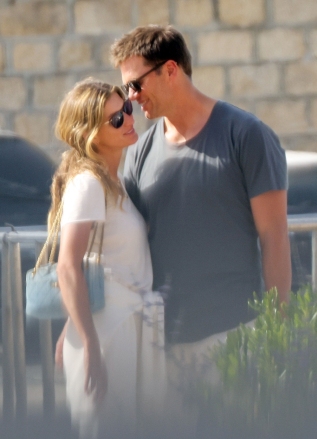 Saint-Tropez, FRANCE  - *EXCLUSIVE*  - Tom Brady cuddles up to his wife, Gisele Bunchchen, as the couple enjoys a romantic getaway to Saint Tropez. The Brazilian model smiled as Tom leaned in and whispered in her ear as the couple was spotted briefly over the weekend during a casual outing. The pair, who have been married for 13 years, has been enjoying some time together before Tom returns to the field again for his 23rd NFL season after initially announcing his retirement in February. The seven-time Super Bowl champion and five-time Super Bowl MVP announced roughly a month later that he'd changed his mind and would play another season with the Buccaneers.  *PHOTOS SHOT ON 06/27/2022*  Pictured: Gisele Bundchen, Tom Brady  BACKGRID USA 29 JUNE 2022   BYLINE MUST READ: BACKGRID  USA: +1 310 798 9111 / usasales@backgrid.com  UK: +44 208 344 2007 / uksales@backgrid.com  *UK Clients - Pictures Containing Children Please Pixelate Face Prior To Publication*