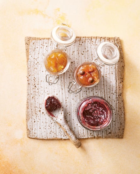 Open jars of muntrie jam and rosella jam.