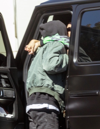 Calabasas, CA  - *EXCLUSIVE*  - Kourtney Kardashian and husband Travis Barker refuse to let a moment go by where they're not locked up in an embrace. The lovebirds met up in Calabasas for some PDA before Travis heads to the studio. Kourtney steps out of her car to snap some pics of the skeleton that Travis has in his truck.  Pictured: Kourtney Kardashian, Travis Barker  BACKGRID USA 26 OCTOBER 2022   USA: +1 310 798 9111 / usasales@backgrid.com  UK: +44 208 344 2007 / uksales@backgrid.com  *UK Clients - Pictures Containing Children Please Pixelate Face Prior To Publication*