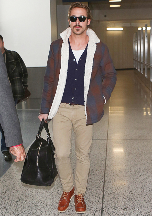 Ryan Gosling wearing shearling jacket at airport