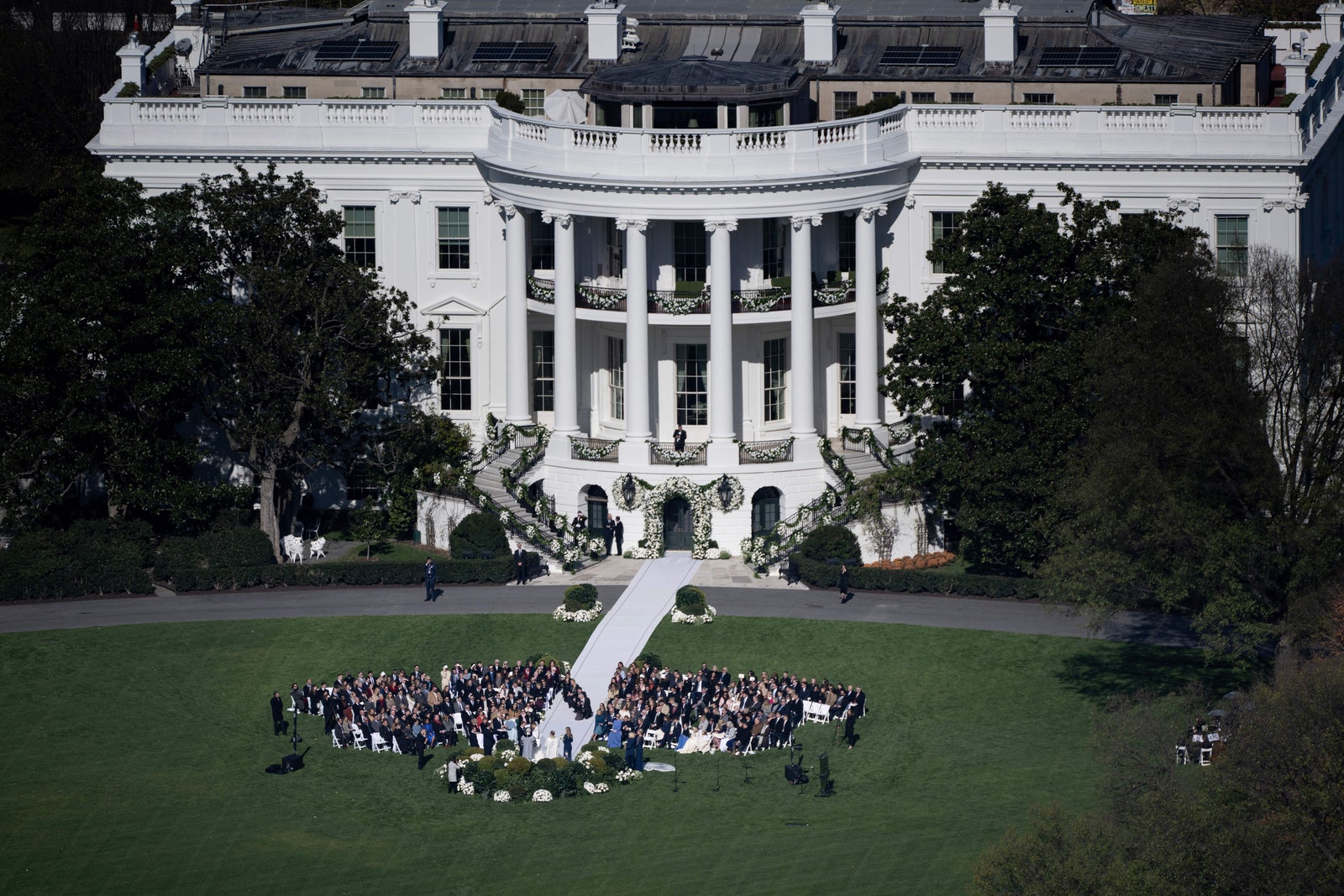 Guests gather on the South Lawn of the White House in Washington DC for the wedding of Naomi Biden  28 granddaughter of...