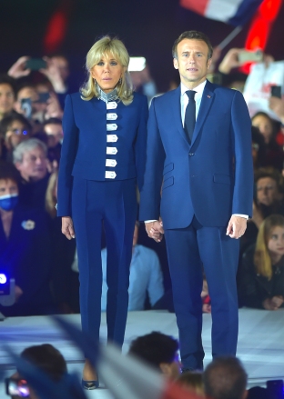 France's centrist incumbent president Emmanuel Macron stands with his wife Brigitte Macron after he beats his far-right rival Marine Le Pen for a second five-year term as president on April 24, 2022 in Paris Emmanuel Macron re-elected as French President, Paris, France - 24 Apr 2022