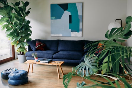 Jade Crusade, a painting bought by Brad Gordon Smith, sits on his living room wall, surrounded by plants.