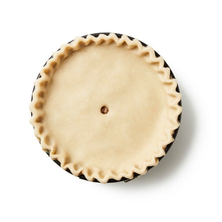 Seal, then crimp: Pinch together the edges of the case and lid to seal, then crimp all around the edge (there are many videos online), or press down with the flat tines of a fork. Poke a large hole in the centre with the handle of a wooden spoon or similar, then, if you like, decorate the lid with any pastry trimmings.