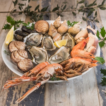 A seafood platter with lobster, mussels and oysters.