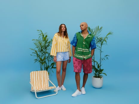 Scarlet wears Jamoo jumper and shorts; Bensimon sneakers (available at Robert Burton); Lucy Folk gold cuff and bracelet and Arms of Eve shell necklace. Tarquin wears Jamoo shirt and shorts and Reebok sneakers. Sunday Supply Co. beach chair.
