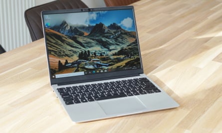 The Framework Laptop open on a wooden table.