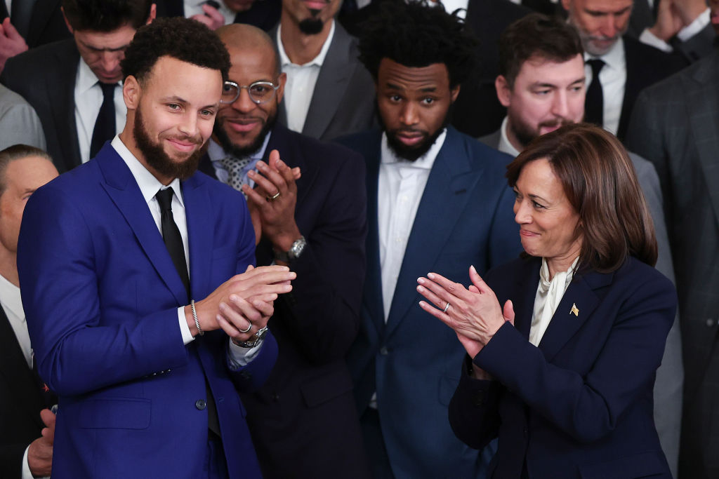 WASHINGTON, DC - JANUARY 17: U.S. Vice President Kamala Harris (R) and NBA star Steph Curry (L) applaud during a ceremony honoring the Golden State Warriors in the East Room of the White House January 17, 2023 in Washington, DC. The Warriors won the 2022 NBA Championship. (Photo by Win McNamee/Getty Images)