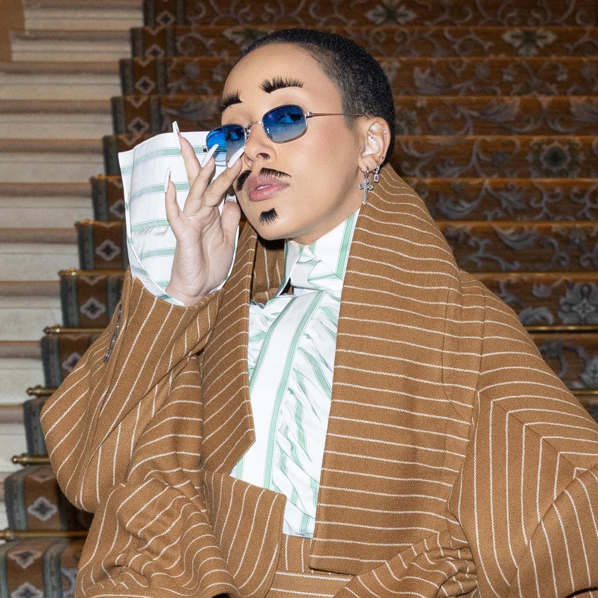 Doja Cat’s incredible looks at Paris Fashion Week: Including her $20K bedazzled tequila purse