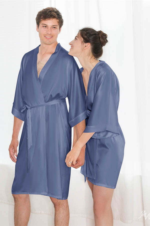 Couple wearing matching satin robes.