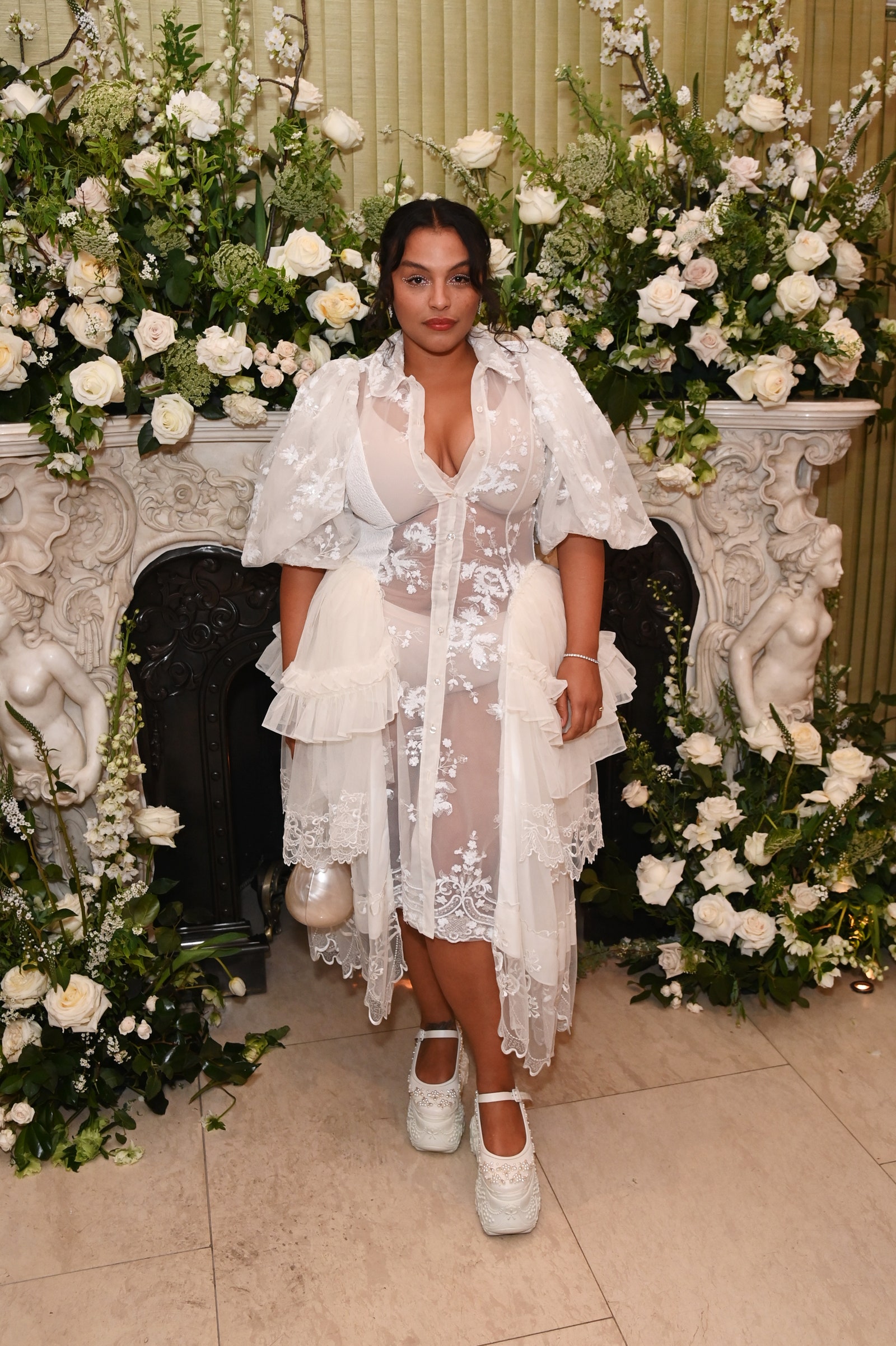 Paloma Elsesser in sheer white ruffles and embroidery.