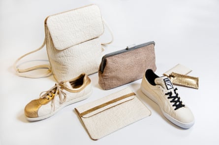 A range of leather-look products - including a backpack, a purse, and shoes - made from pineapple leather, on a white background.