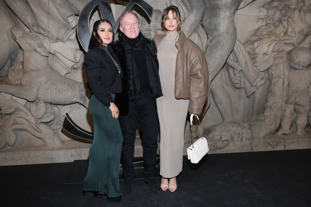PARIS, FRANCE - FEBRUARY 28: (EDITORIAL USE ONLY - For Non-Editorial use please seek approval from Fashion House) (L to R) Salma Hayek, François-Henri Pinault and Mathilde Pinault attend the Saint Laurent Womenswear Fall Winter 2023-2024 show as part of Paris Fashion Week on February 28, 2023 in Paris, France. (Photo by Pascal Le Segretain/Getty Images)