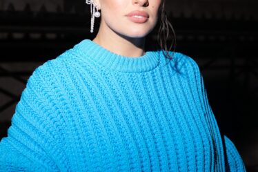 NEW YORK NEW YORK  FEBRUARY 02 Ashley Graham is seen wearing a blue sweater dress at the Marc Jacobs Runway Show 2023 at...