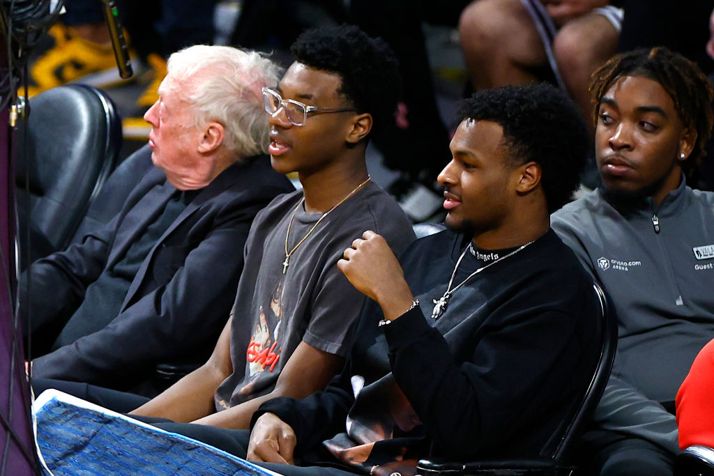 LOS ANGELES, CALIFORNIA - FEBRUARY 07: Phil Knight, Bryce James and Bronny James look on during the game between the Los Angeles Lakers and the Oklahoma City Thunder at Crypto.com Arena on February 07, 2023 in Los Angeles, California. NOTE TO USER: User expressly acknowledges and agrees that, by downloading and or using this photograph, User is consenting to the terms and conditions of the Getty Images License Agreement. (Photo by Ronald Martinez/Getty Images)