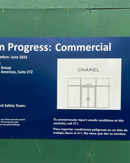 A public government poster for a work in progress commercial site that names Chanel.