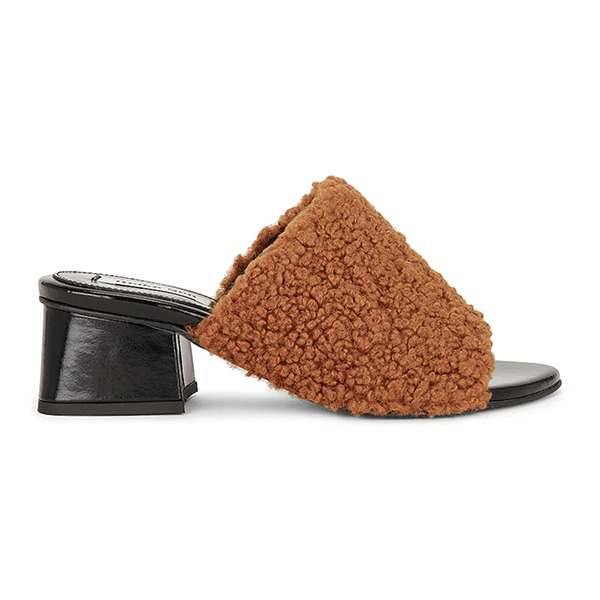 A slip-on block heel lined with black leather and brown bouclé fabric