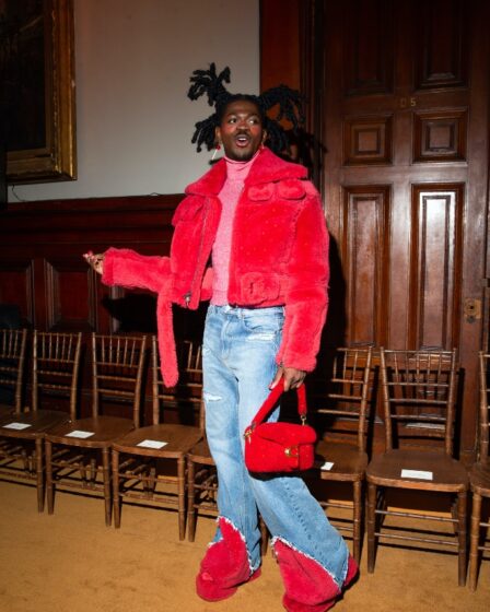 Lil Nas X, jeans, blue jeans, red jeans, slides, platforms, platform slides, red slides, Tabby, Tabby handbag, Coach, NYFW, New York Fashion Week, fall 2023, fashion show, front row