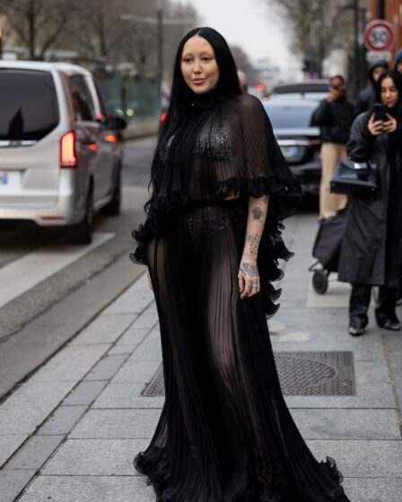 Noah Cyrus wears black pleated see trough dress outside Alexandre Vauthier during Paris Fashion Week.