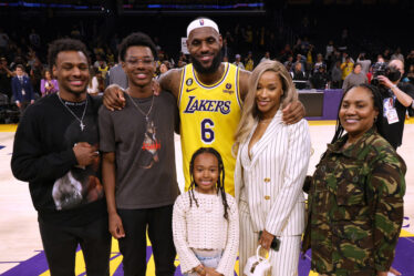 LOS ANGELES, CALIFORNIA - FEBRUARY 07: LeBron James #6 of the Los Angeles Lakers poses for a picture with his family at the end of the game, (L-R) Bronny James, Bryce James, Zhuri James Savannah James and Gloria James, passing Kareem Abdul-Jabbar to become the NBA's all-time leading scorer, surpassing Abdul-Jabbar's career total of 38,387 points against the Oklahoma City Thunder at Crypto.com Arena on February 07, 2023 in Los Angeles, California. (Photo by Harry How/Getty Images)