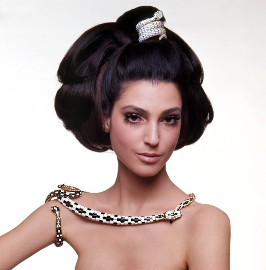 Model Benedetta Barzini wearing Serpenti bracelets-watches and belt, 1968.