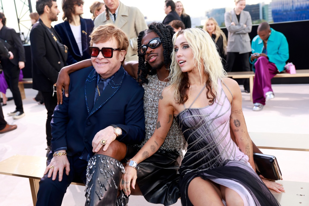WEST HOLLYWOOD, CALIFORNIA - MARCH 09: (L-R) Elton John, Lil Nas X, and Miley Cyrus attend the Versace FW23 Show at Pacific Design Center on March 09, 2023 in West Hollywood, California. (Photo by Emma McIntyre/Getty Images)