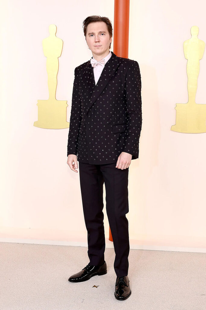 

You can always rely on Paul Dano to provide a bit of flare, as his custom wine Dolce & Gabbana Sicilia-fit double-breasted jacket was decked out embroidered and paired with a rose pale pink satin shirting and bow tie.

2023 Oscars