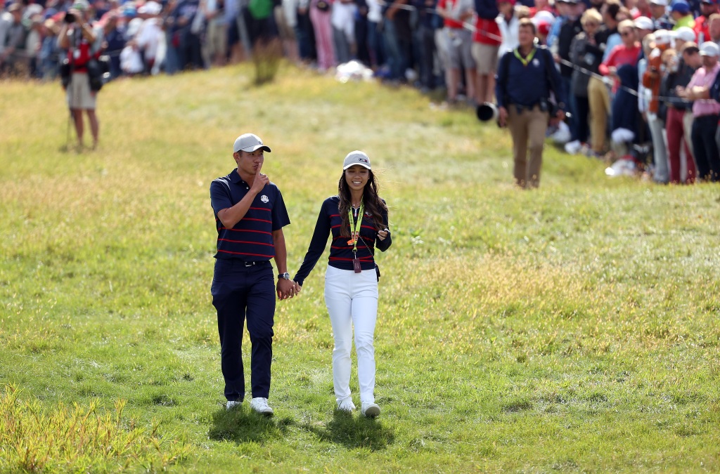 KOHLER, WISCONSIN - SEPTEMBER 24: Collin Morikawa of team United States and girlfriend Katherine Zhu walk across the course during Friday Afternoon Fourball Matches of the 43rd Ryder Cup at Whistling Straits on September 24, 2021 in Kohler, Wisconsin. (Photo by Patrick Smith/Getty Images)