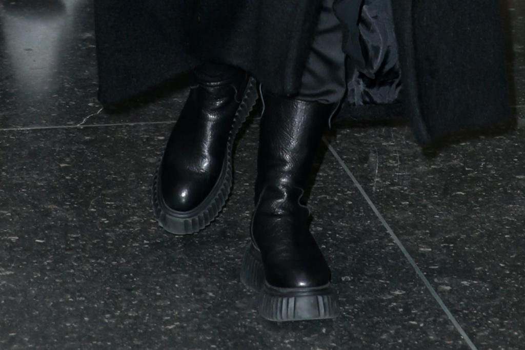dove cameron, black coat, leather lug sole boots, sunglasses, nyc