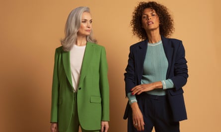 women in green and navy trousers suits 