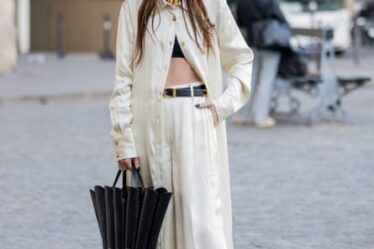 Loulou Studio founder Chloe Harrouche in beige wide leg pants at Paris fashion week in March, 2023.