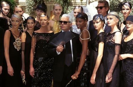 Karl Lagerfeld with models in Paris, July 1996.