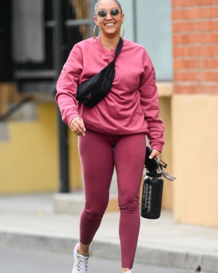 tia mowry, la, matching workout set, pink, leggings, sweatshirt, sneakers, belt bag