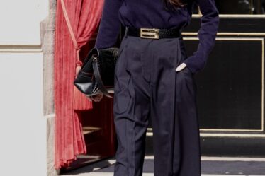 Victoria Beckham wearing a navy blue turtleneck sweater and trousers during paris fashion week