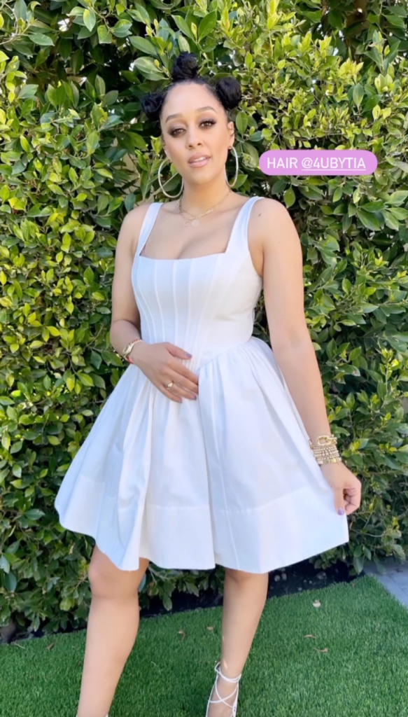 tia mowry wears a corset dress with strappy peep-toe pumps