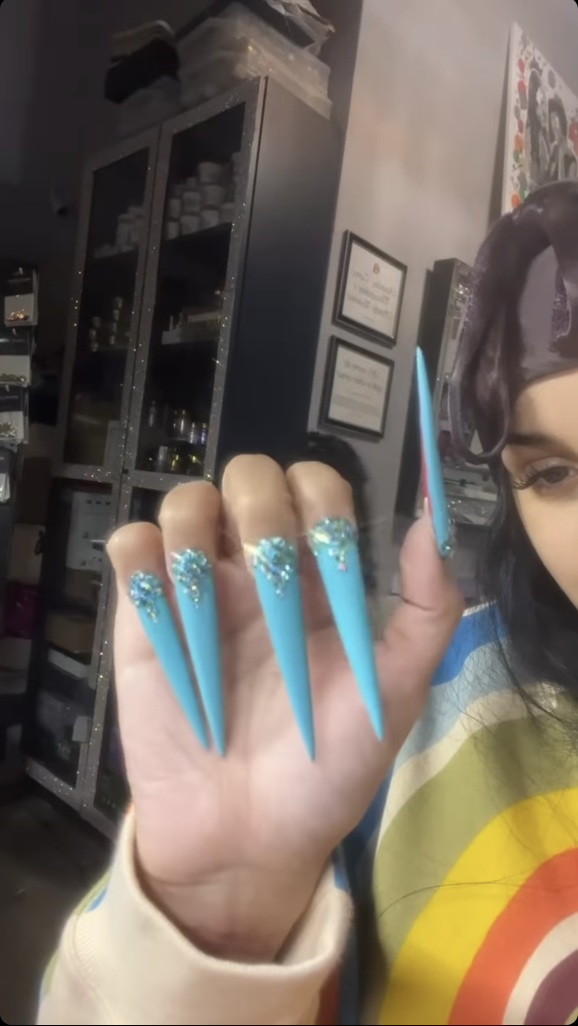 cardi b's bedazzled baby blue nails screenshotted from her instagram stories