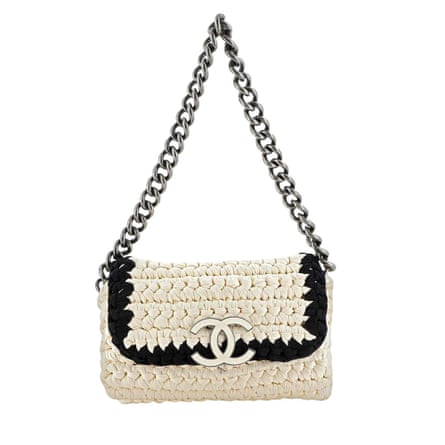white chanel bag with black trim and chain hande