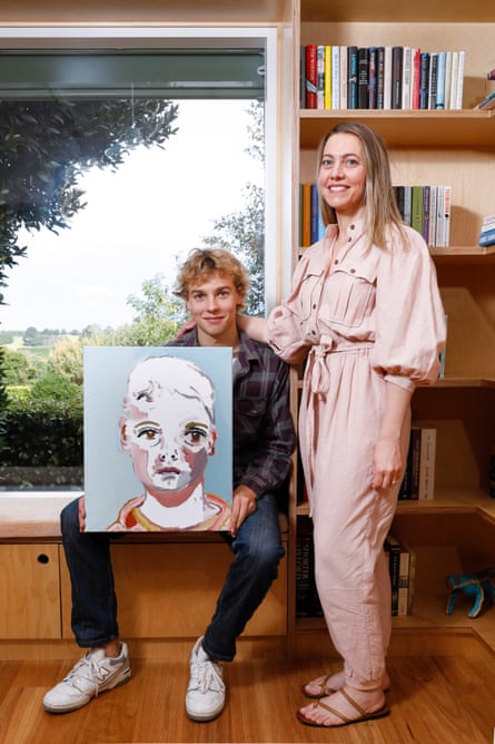 Kylie Needham and her 17-year-old son Joe Quilty with a self-portrait that he painted when he was 12 years old.