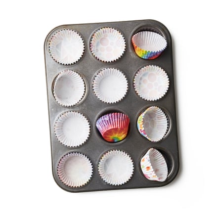 Fill a shallow-holed fairy cake (or jam tart) tin with paper cases. If you don’t have cases, grease the holes well with oil or butter, so the cakes don’t stick to the tin – you can use a pastry brush, clean kitchen roll or the butter wrapper to help spread it around