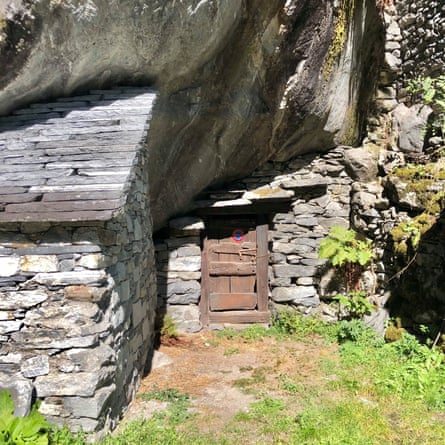 small door under huge rock