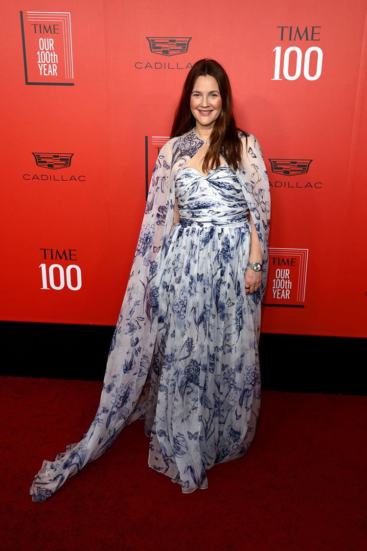 Drew Barrymore floated down the red carpet wearing a dreamy Oscar de la Renta gown featuring her favourite accessory: a cape. 

TIME100 gala