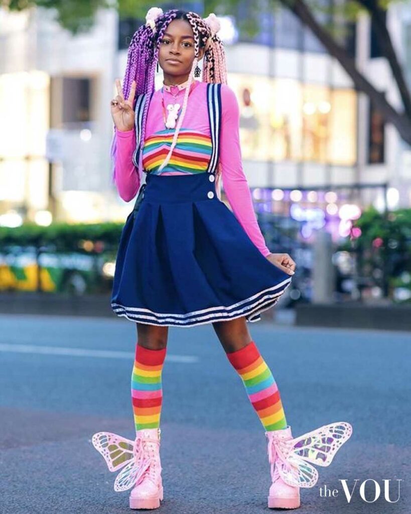 chocker, long-sleeve top, miniskirt, rainbow knee-high socks, butterfly detail boots,