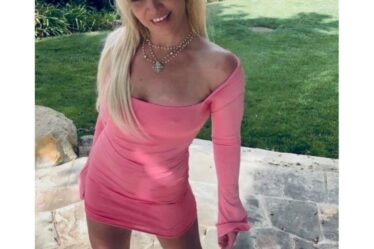 britney spears wearing a pink dress with white boots