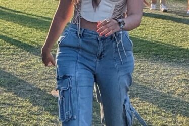 Camila Cabello, jeans, blue jeans, corset, corset top, sneakers, white sneakers, chunky sneakers, platforms, platform sneakers, womens sneakers, lace up sneakers, Coachella, music festival, California, Coachella Day 1, Bad Bunny, performance, music, musical performance, concert
