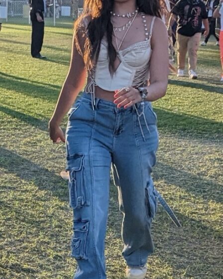 Camila Cabello, jeans, blue jeans, corset, corset top, sneakers, white sneakers, chunky sneakers, platforms, platform sneakers, womens sneakers, lace up sneakers, Coachella, music festival, California, Coachella Day 1, Bad Bunny, performance, music, musical performance, concert