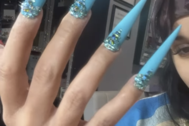 cardi b's bedazzled baby blue nails screenshotted from her instagram stories