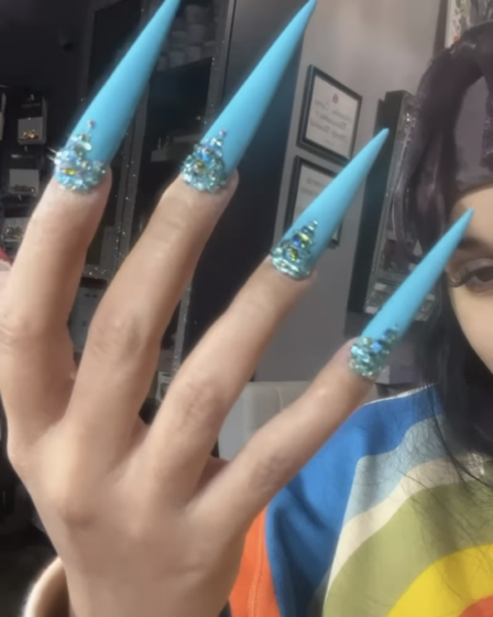 cardi b's bedazzled baby blue nails screenshotted from her instagram stories