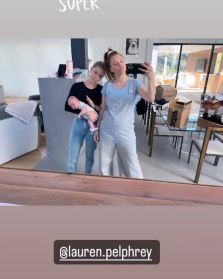 Kaley Cuoco wearing overalls on Instagram. with new baby girl in selfie, no makeup