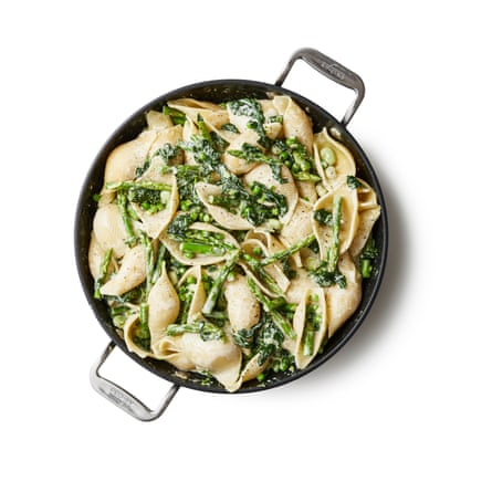 A pan of finished pasta primavera. Drain the pasta well, add to the pan and toss until it’s all coated with sauce. Scatter over the roughly torn mint and basil leaves, divide between plates, top liberally with the toasted pine nuts and grated cheese, and serve.